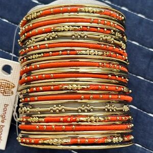 Set of 34 bangles (gold color and orange silk thread) by Amrita Singh NWT